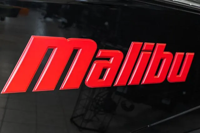 Slide: The Image of Close-up of 2024 Malibu 23 LSV boat model nameplate. - 3