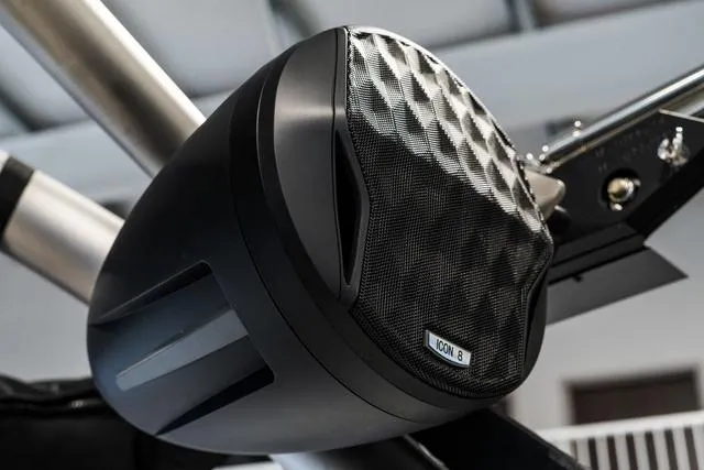 Slide: The Image of 2024 Malibu 23 LSV boat interior with red, white, and gray seating. - 32