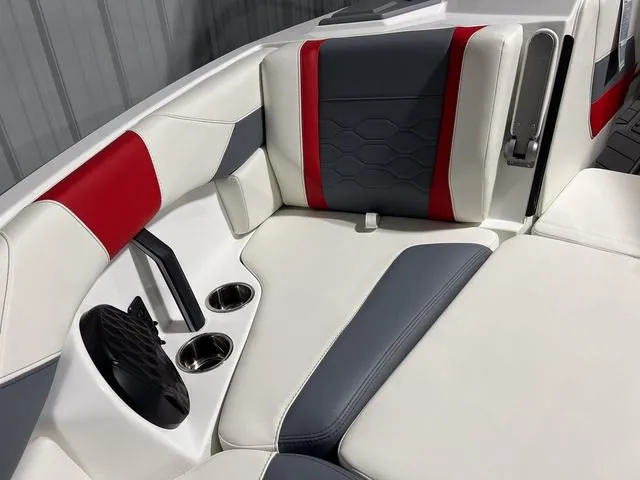 Slide: The Image of 2024 Malibu 23 LSV boat storage compartment with open lid. - 36