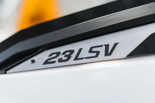Slide: The Image of 2024 Malibu 23 LSV boat with Surf Gate technology in a garage. - 4