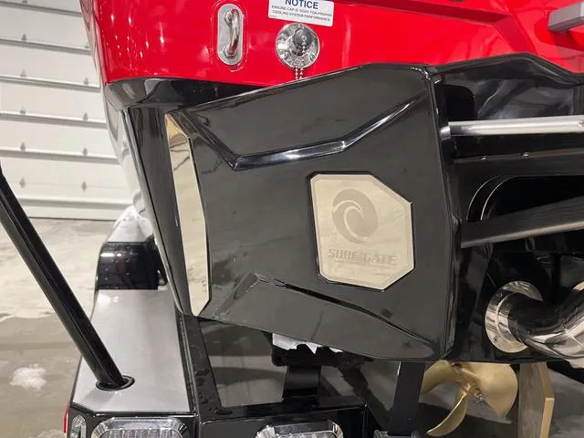 Slide: The Image of 2024 Malibu 23 LSV boat rear view with swim platform and seating. - 5