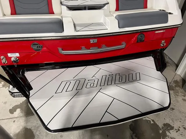 Slide: The Image of 2024 Malibu 23 LSV boat stern with propeller and Power Wedge III. - 6