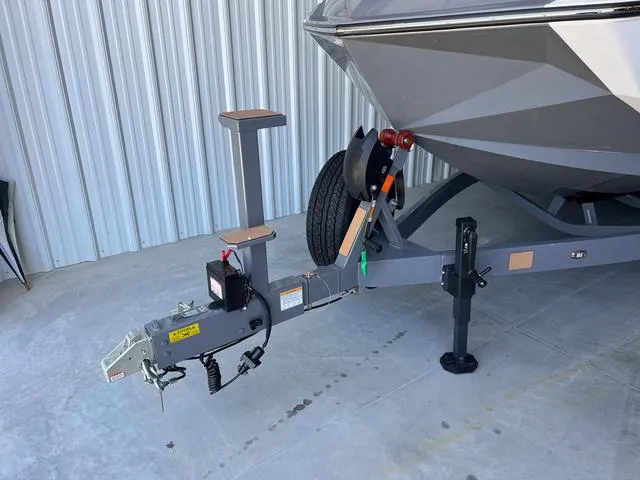 Slide: The Image of 2024 Nautique Super Air Nautique G23 boat trailer hitch and bow detail. - 4
