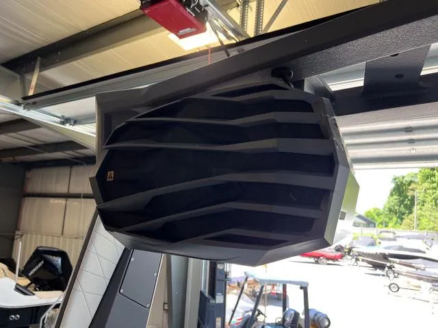 Slide: The Image of 2024 Nautique Super Air Nautique G23 boat speaker in a garage. - 41