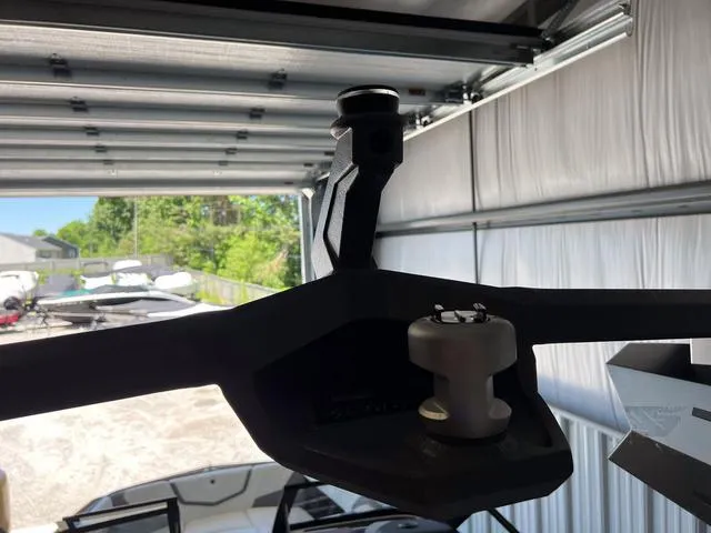 Slide: The Image of 2024 Nautique Super Air Nautique G23 boat in a garage, close-up of tower mount. - 42