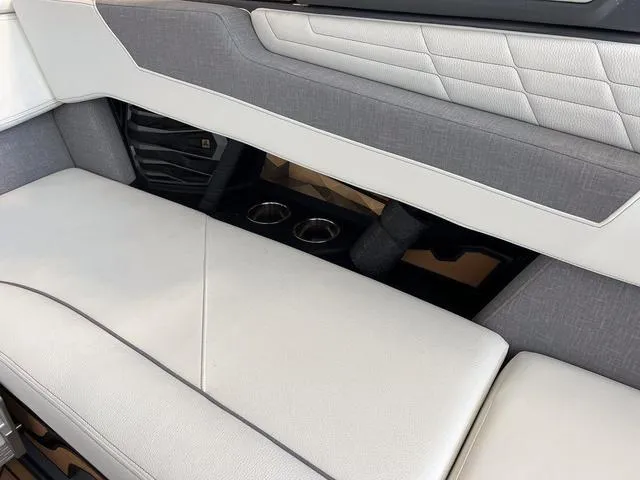 Slide: The Image of 2024 Nautique Super Air Nautique G23 interior seating with cup holders. - 45