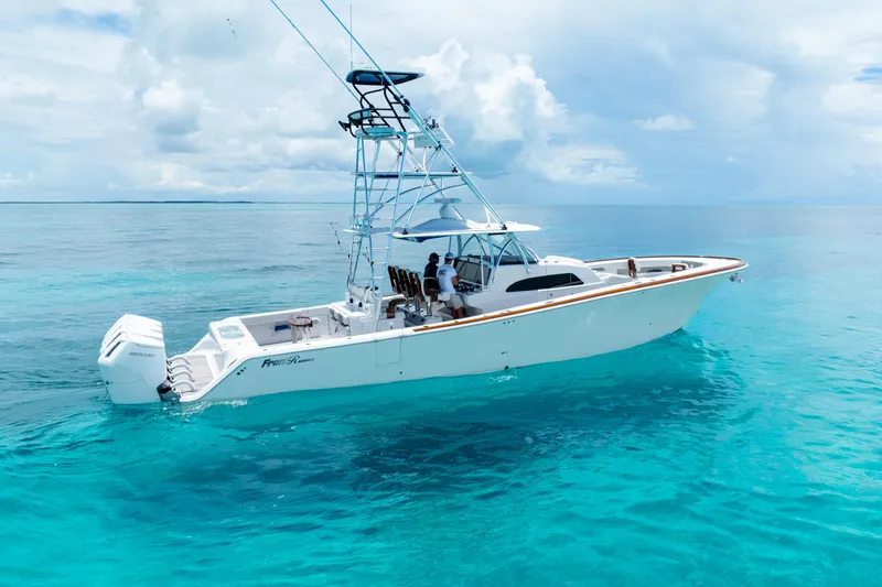 The Image of 2023 Front Runner 47 Center Console boat on clear blue water. - 0
