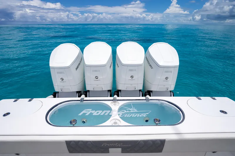 Slide: The Image of 2023 Front Runner 47 Center Console with four engines on turquoise ocean. - 12
