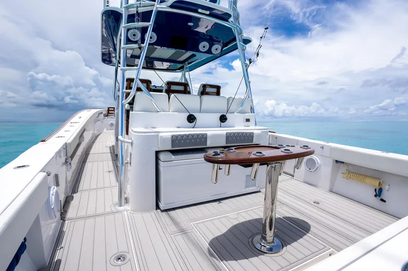 Slide: The Image of 2023 Front Runner 47 Center Console boat with spacious deck and fishing setup. - 13
