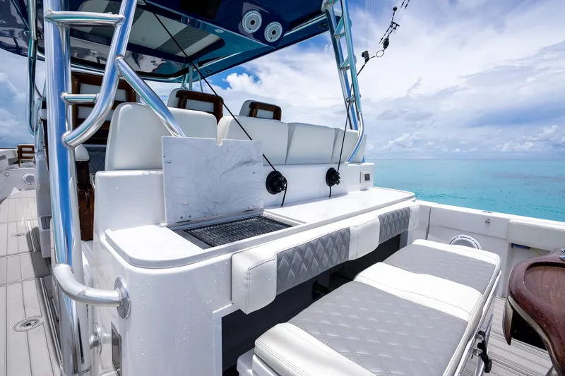 Slide: The Image of 2023 Front Runner 47 Center Console boat with luxurious seating and ocean view. - 14