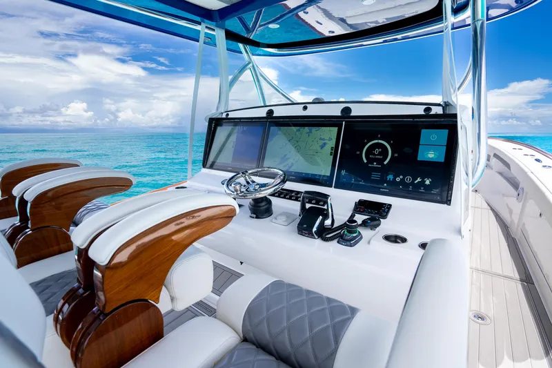 Slide: The Image of 2023 Front Runner 47 Center Console boat cockpit with advanced navigation system. - 27