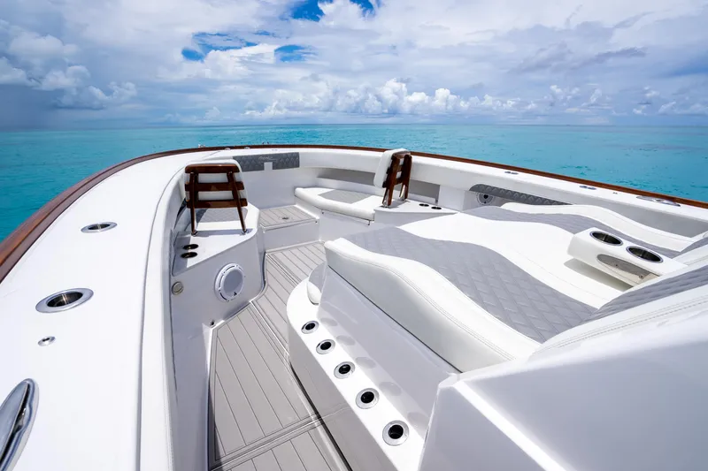 Slide: The Image of 2023 Front Runner 47 Center Console boat with luxurious seating on clear blue water. - 30
