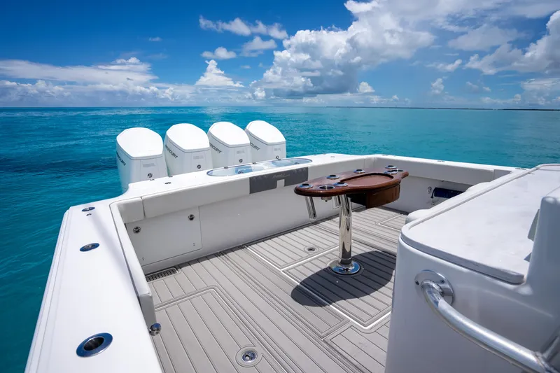 Slide: The Image of 2023 Front Runner 47 Center Console boat on clear blue ocean water. - 37