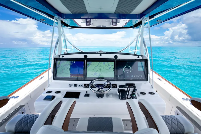Slide: The Image of 2023 Front Runner 47 Center Console boat helm with advanced navigation displays. - 4
