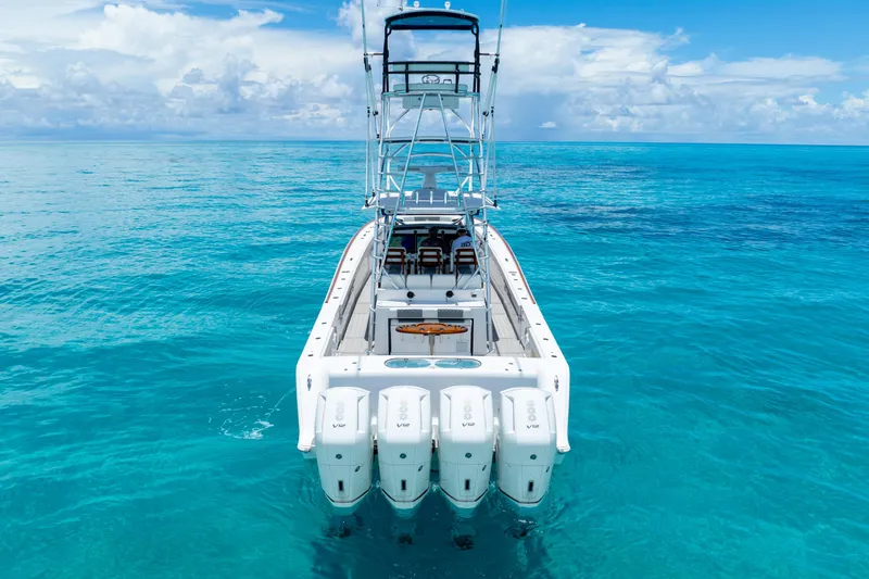Slide: The Image of 2023 Front Runner 47 Center Console boat on clear blue water. - 40