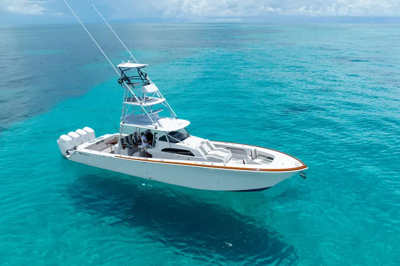 Slide: The Image of 2023 Front Runner 47 Center Console boat on clear blue water. - 42