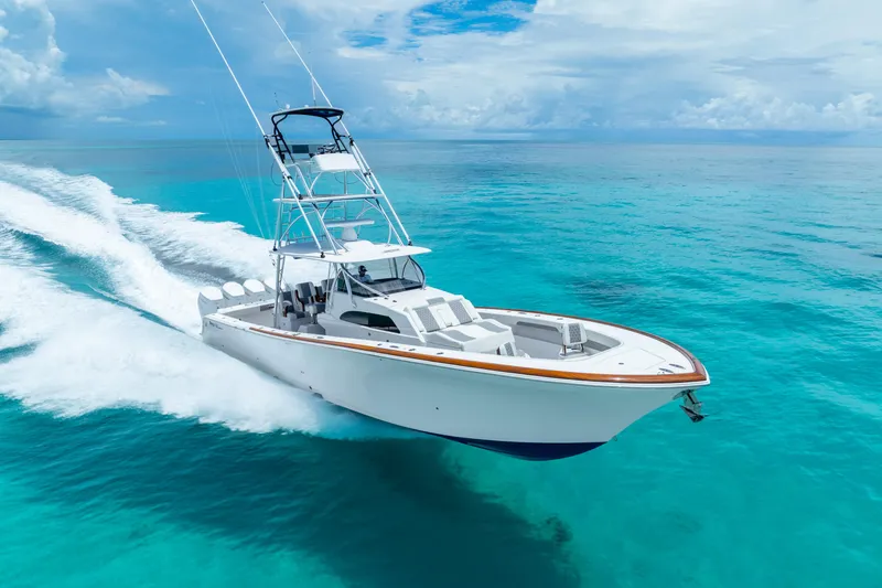 Slide: The Image of 2023 Front Runner 47 Center Console boat cruising on clear blue ocean. - 43