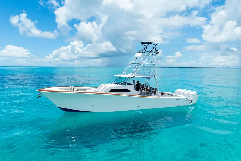 Slide: The Image of 2023 Front Runner 47 Center Console boat on clear blue water. - 48