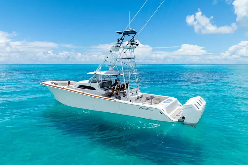 Slide: The Image of 2023 Front Runner 47 Center Console boat on clear blue ocean water. - 50