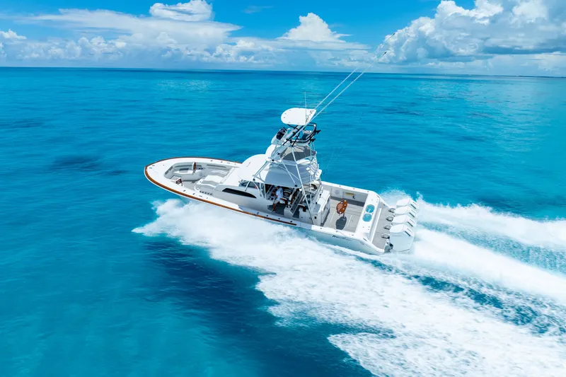 Slide: The Image of 2023 Front Runner 47 Center Console boat cruising on clear blue ocean. - 51