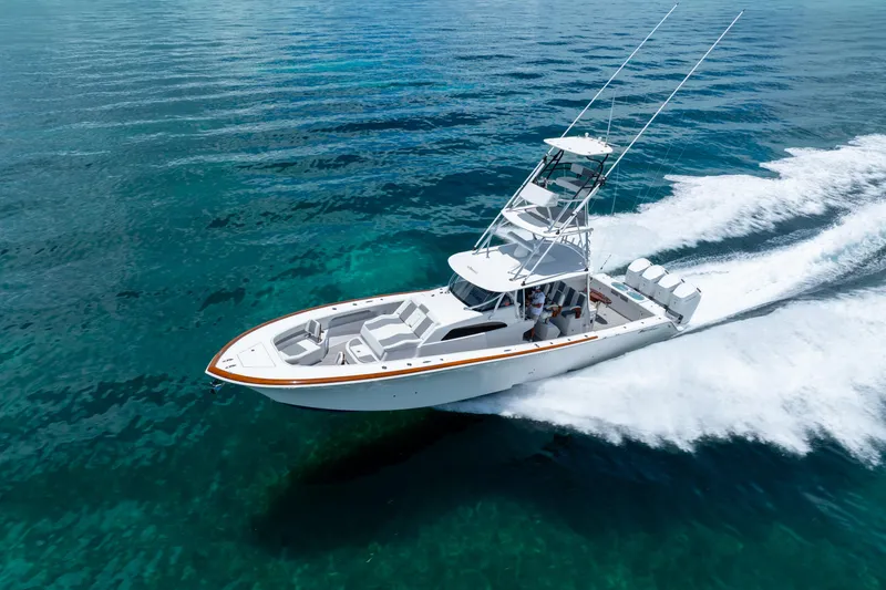 Slide: The Image of 2023 Front Runner 47 Center Console boat cruising on clear blue water. - 52
