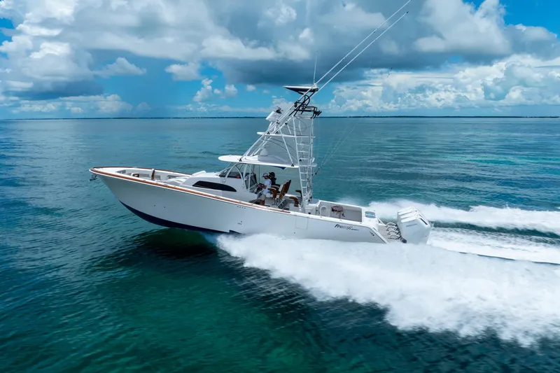 Slide: The Image of 2023 Front Runner 47 Center Console boat cruising on open water. - 53