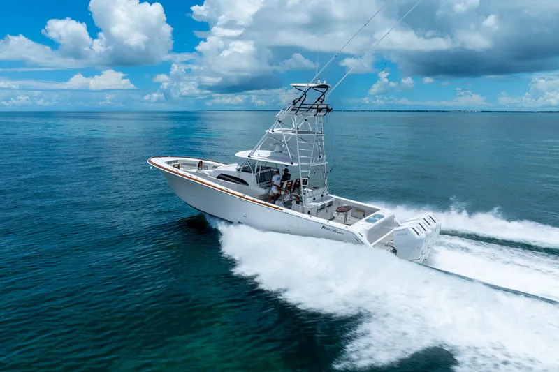 Slide: The Image of 2023 Front Runner 47 Center Console boat cruising on open water. - 54
