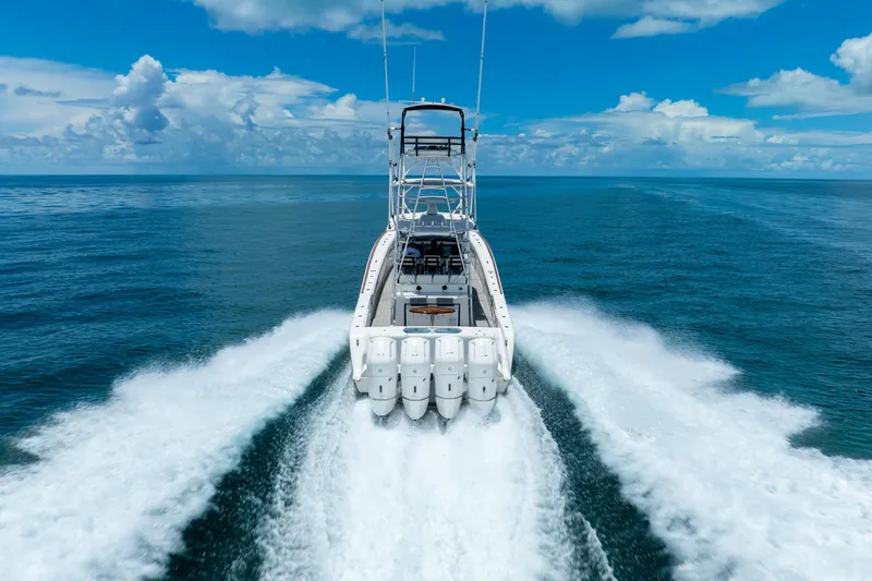 Slide: The Image of 2023 Front Runner 47 Center Console boat speeding on open water. - 55
