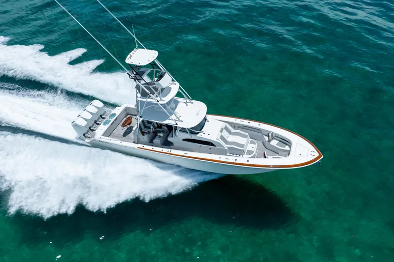 Slide: The Image of 2023 Front Runner 47 Center Console boat cruising on clear blue water. - 57