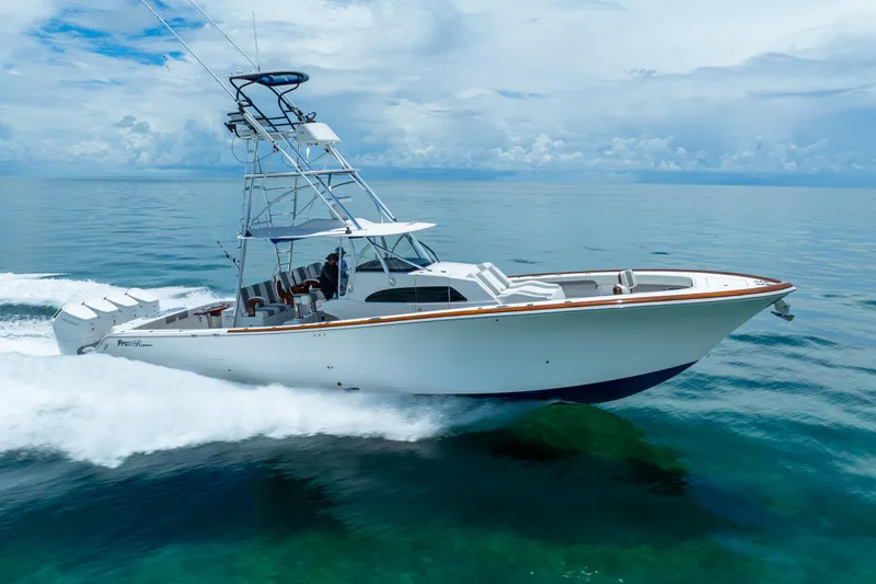 Slide: The Image of 2023 Front Runner 47 Center Console boat cruising on open water. - 58