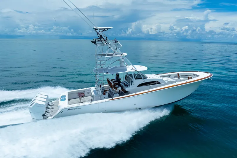 Slide: The Image of 2023 Front Runner 47 Center Console boat cruising on open water. - 59