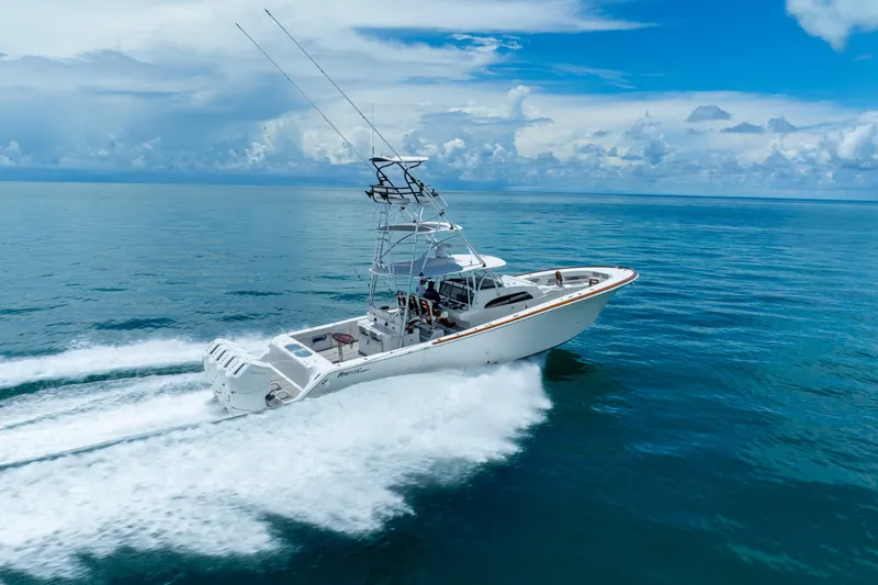 Slide: The Image of 2023 Front Runner 47 Center Console boat cruising on open water. - 60