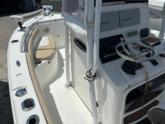 Slide: The Image of 2017 Sea Pro 219 Center Console boat interior with Garmin electronics and seating. - 11