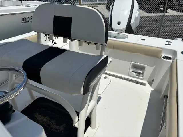 Slide: The Image of 2017 Sea Pro 219 Center Console boat interior with seating and steering wheel. - 16