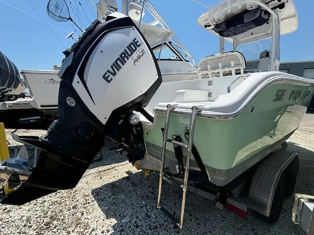 Slide: The Image of 2017 Sea Pro 219 Center Console boat with Evinrude engine on trailer. - 20