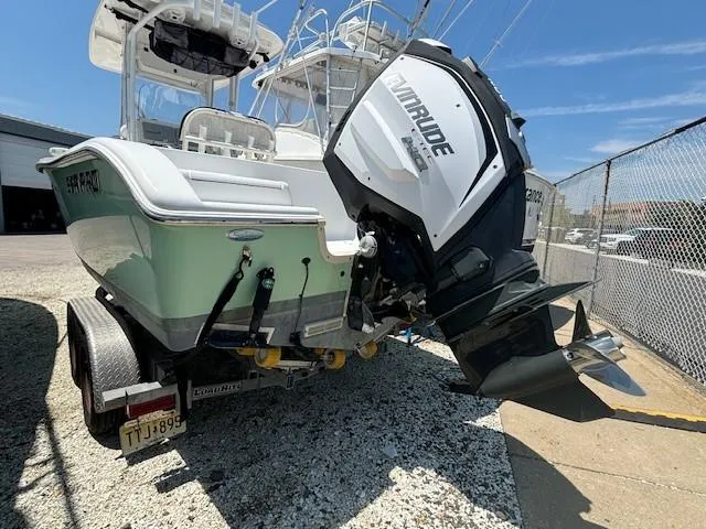 Slide: The Image of 2017 Sea Pro 219 Center Console boat with Evinrude engine on trailer. - 21