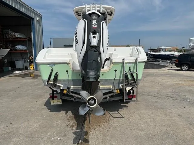 Slide: The Image of 2017 Sea Pro 219 Center Console boat with Evinrude engine at a marina. - 22