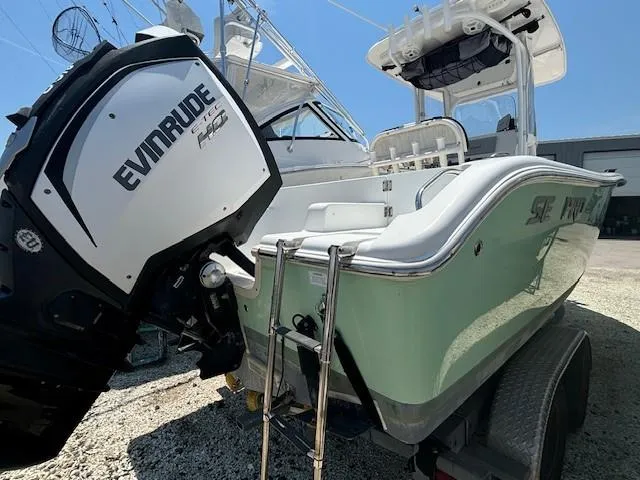 Slide: The Image of 2017 Sea Pro 219 Center Console boat with Evinrude engine, docked on trailer. - 4