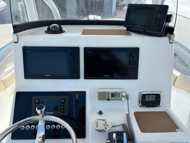 Slide: The Image of 2017 Sea Pro 219 Center Console dashboard with navigation and communication equipment. - 5