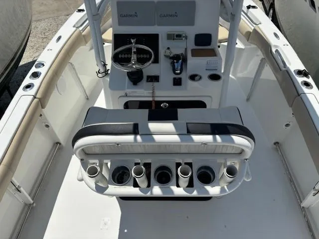 Slide: The Image of 2017 Sea Pro 219 Center Console boat interior with Garmin electronics and rod holders. - 7