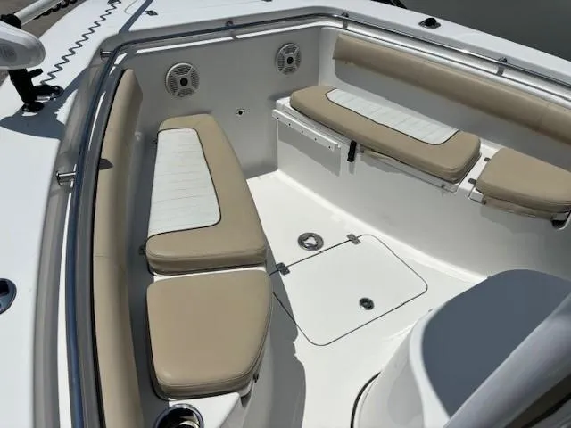 Slide: The Image of 2017 Sea Pro 219 Center Console boat with cushioned seating and storage compartments. - 8