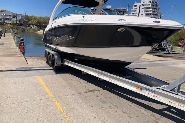 Slide: The Image of 2006 Chaparral 276 SSi boat on trailer at a marina ramp, ready for launch. - 12