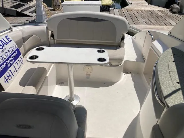 Slide: The Image of 2006 Chaparral 276 SSi boat interior with seating and table, for sale. - 3
