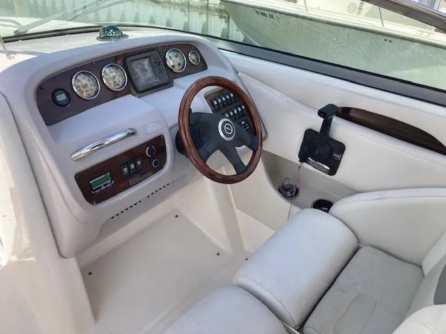 Slide: The Image of 2006 Chaparral 276 SSi boat dashboard with steering wheel and control panel. - 6