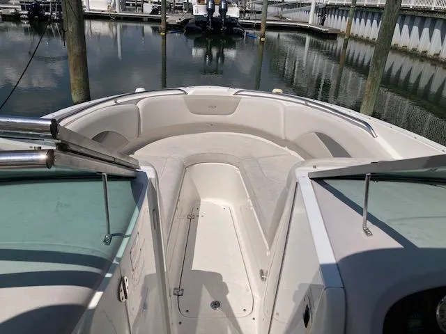 Slide: The Image of 2006 Chaparral 276 SSi boat bow seating area at marina. - 7