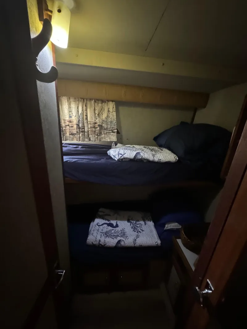 Slide: The Image of Bunk beds in the cabin of a 1986 Carver 36 Mariner yacht. - 14