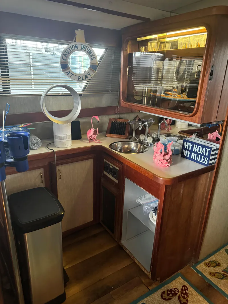 Slide: The Image of Interior of 1986 Carver 36 Mariner boat kitchen with decor and appliances. - 15