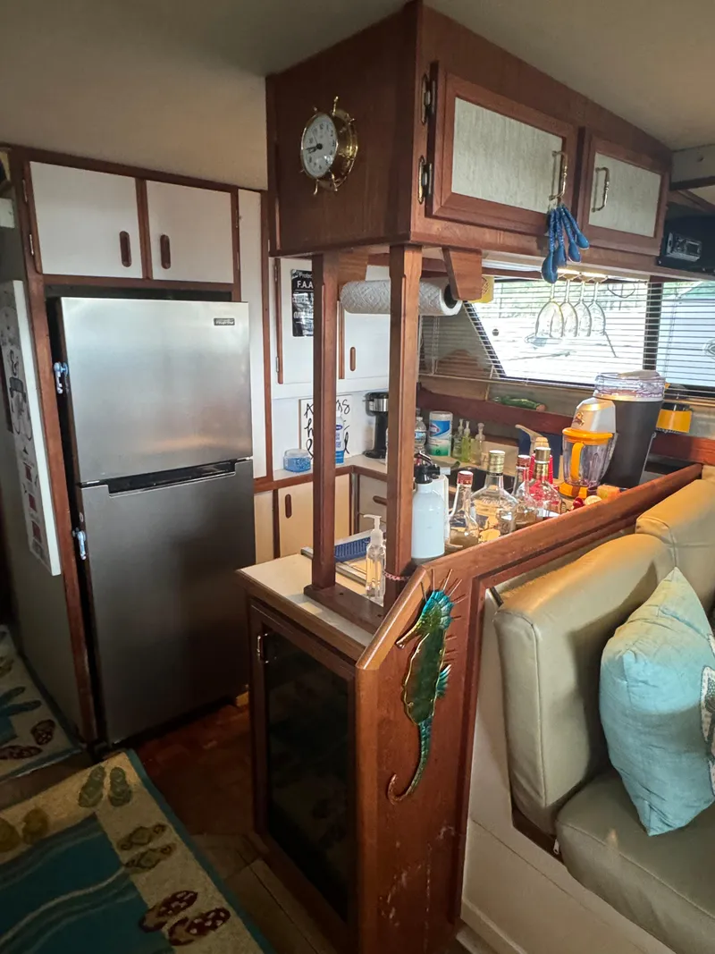 Slide: The Image of Interior of 1986 Carver 36 Mariner yacht with kitchen and seating area. - 17