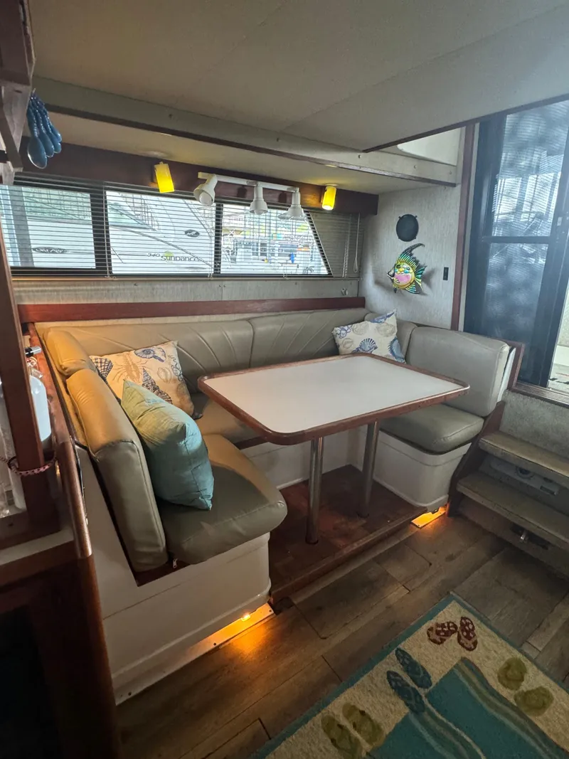 Slide: The Image of Interior of 1986 Carver 36 Mariner with cozy dining area and nautical decor. - 19