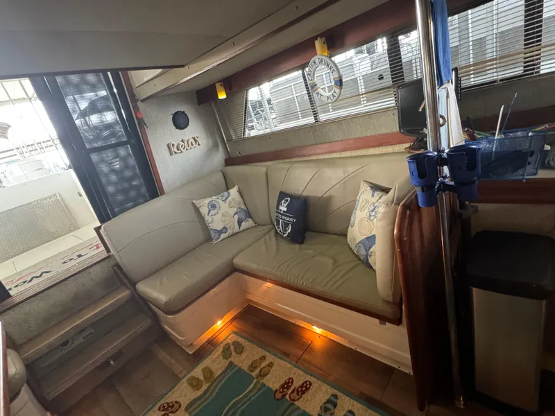 Slide: The Image of Interior of 1986 Carver 36 Mariner with cozy seating area and nautical decor. - 20